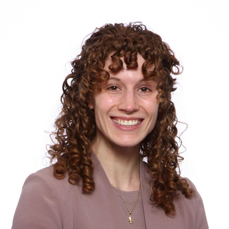 Rachel_Corwin seen with curly hair style and in a pink color outfit